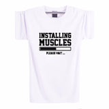 INSTALLING MUSCLES Funny Guy T-Shirt